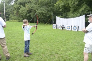 image of youth participant shooting archery